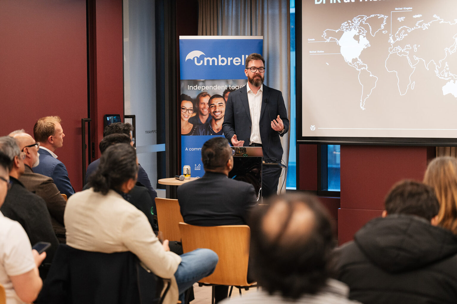 A man speaking with a group of people