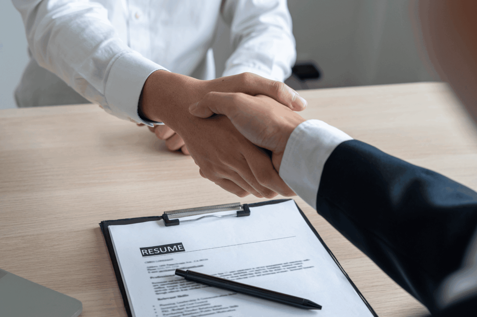 A photo of persons shaking hands